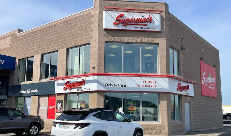Supermac's Family Restaurant with Drive-Thru in Donabate (Turvey), Ireland. Modern brown brick building with prominent 