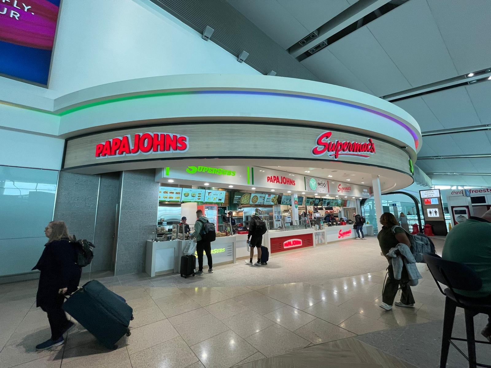 Exterior view of Supermac's and Papa John's in Dublin Airport Terminal Two with signage clearly visible