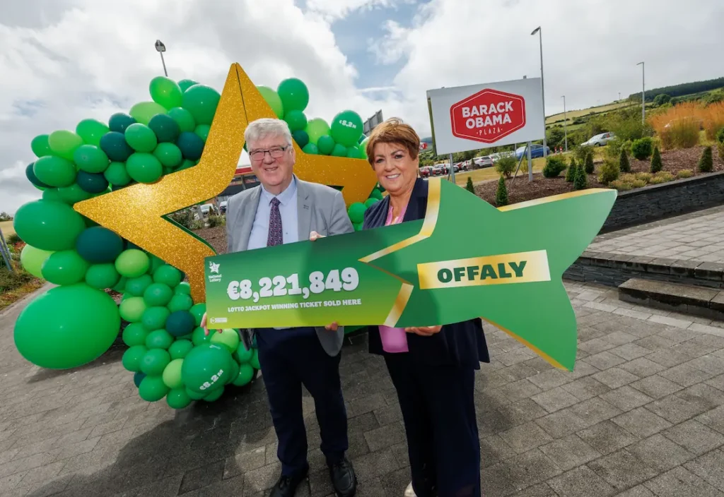 Celebrating the fact that the winning lottery ticket was purchased at the Barack Obama Plaza in Moneygall Offaly located just off Junction 23 on the M7 Motorway from Limerick to Dublin